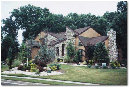 Home with rock facing and chimney